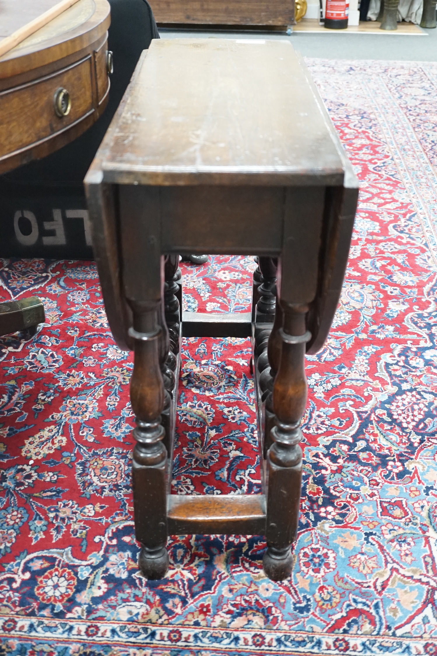 A small 18th century style oak gateleg table, width 76cm, depth 28cm, height 67cm
